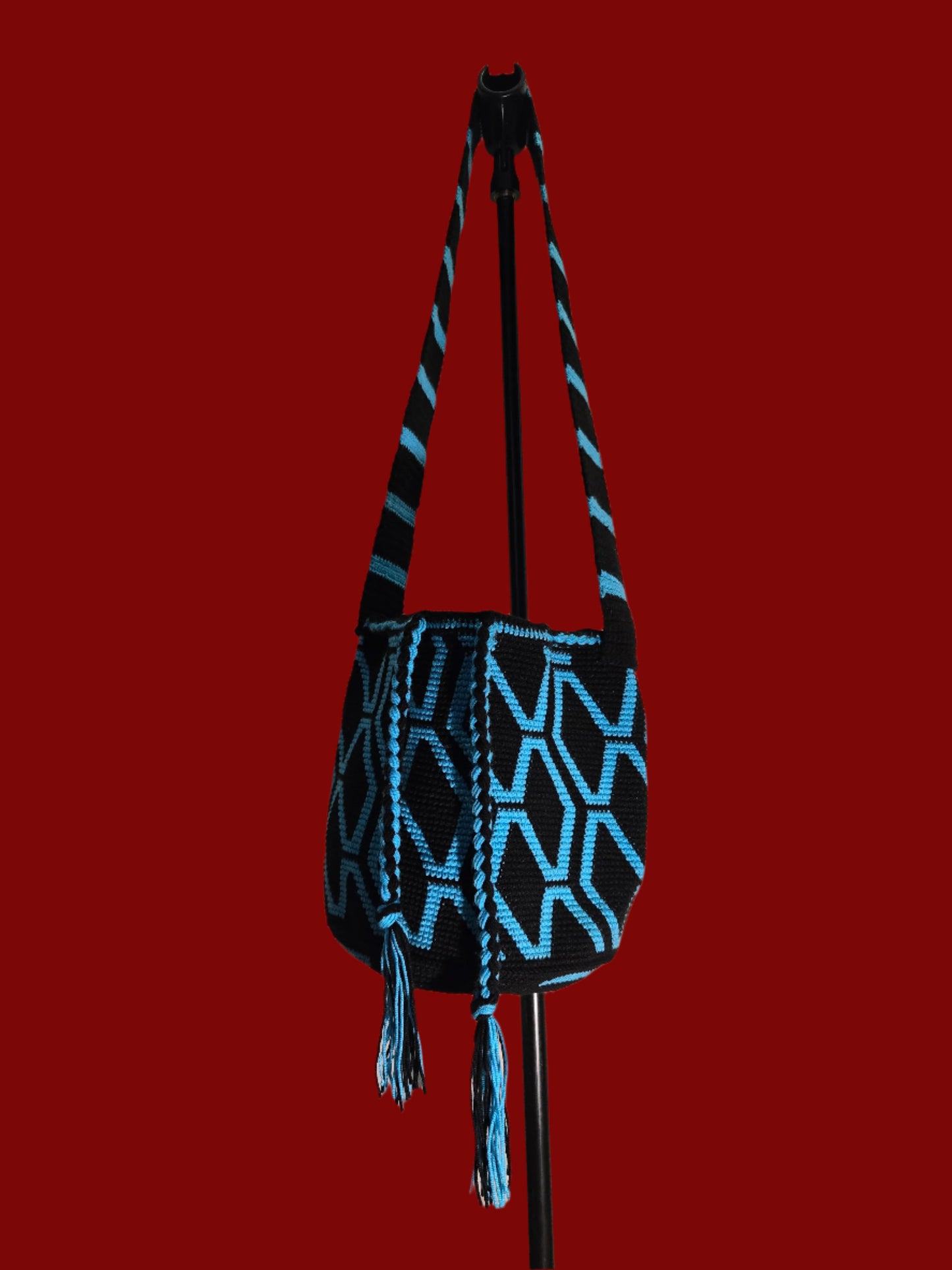 Black and blue bag decorated with blue diamond shapes